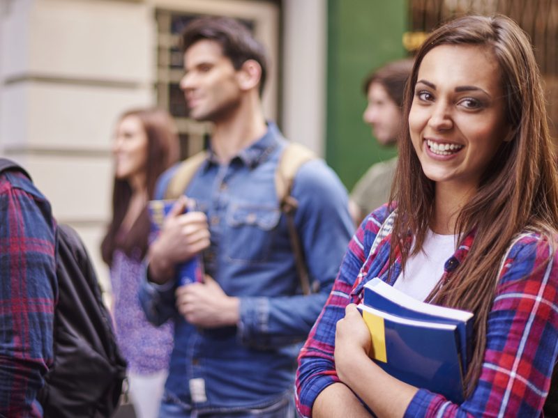 Female student holding her books