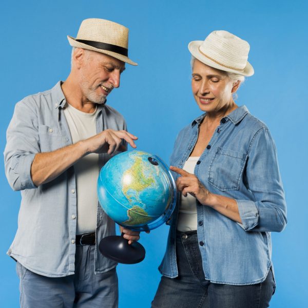 modern-senior-couple-with-globe